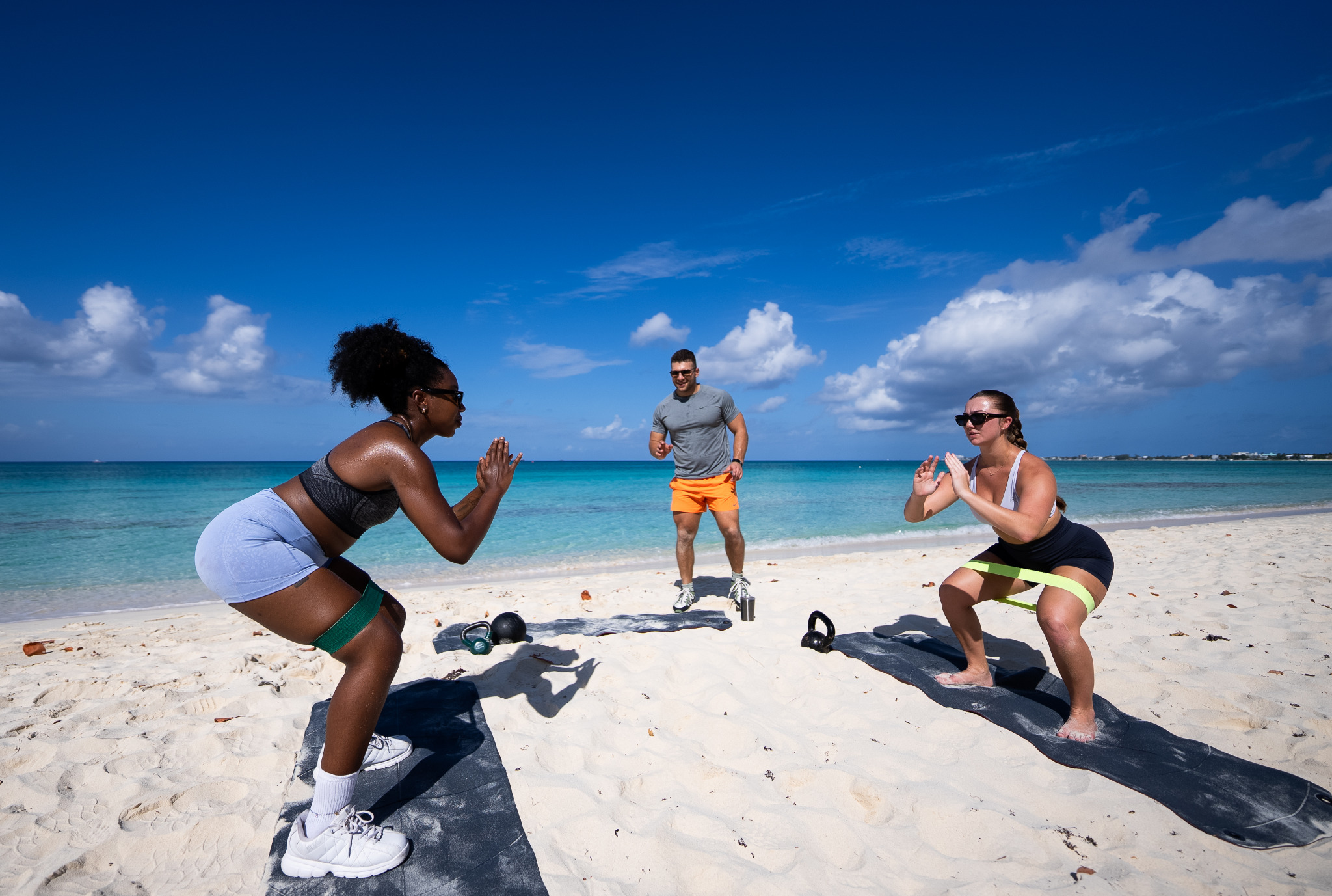Bogdan Nikolic coaching a beach strength session in Grand Cayman
